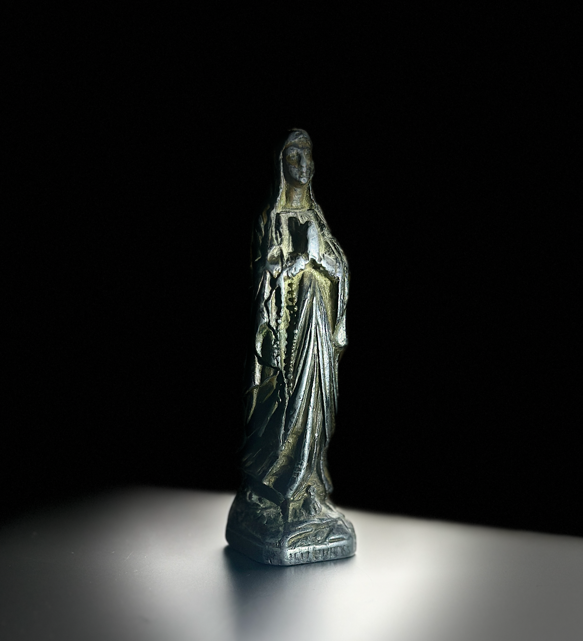 brass statuette of the Virgin Mary